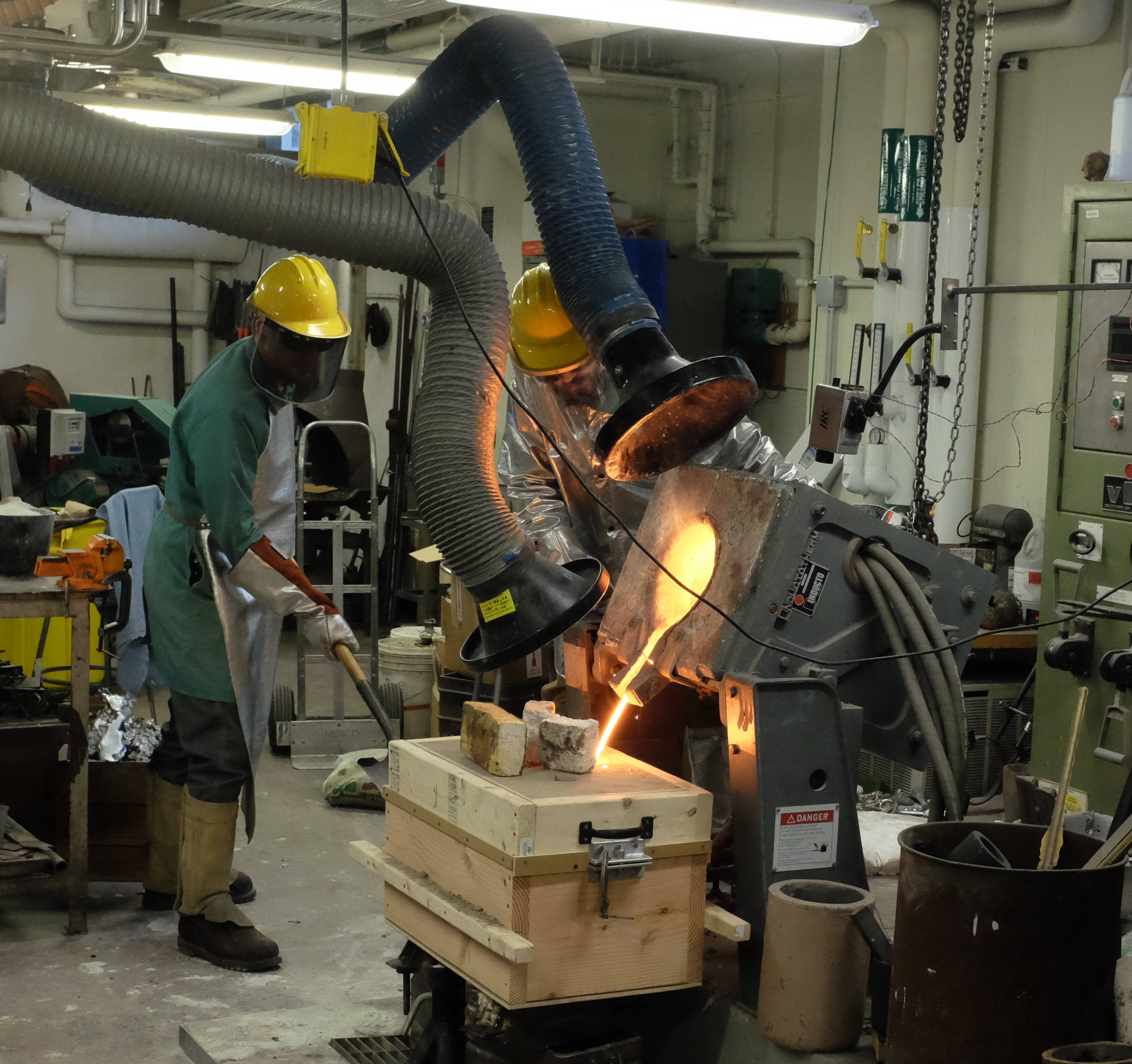 Pouring at the MIT foundry. Nearly 50 lbs of gray iron were poured into the mold.